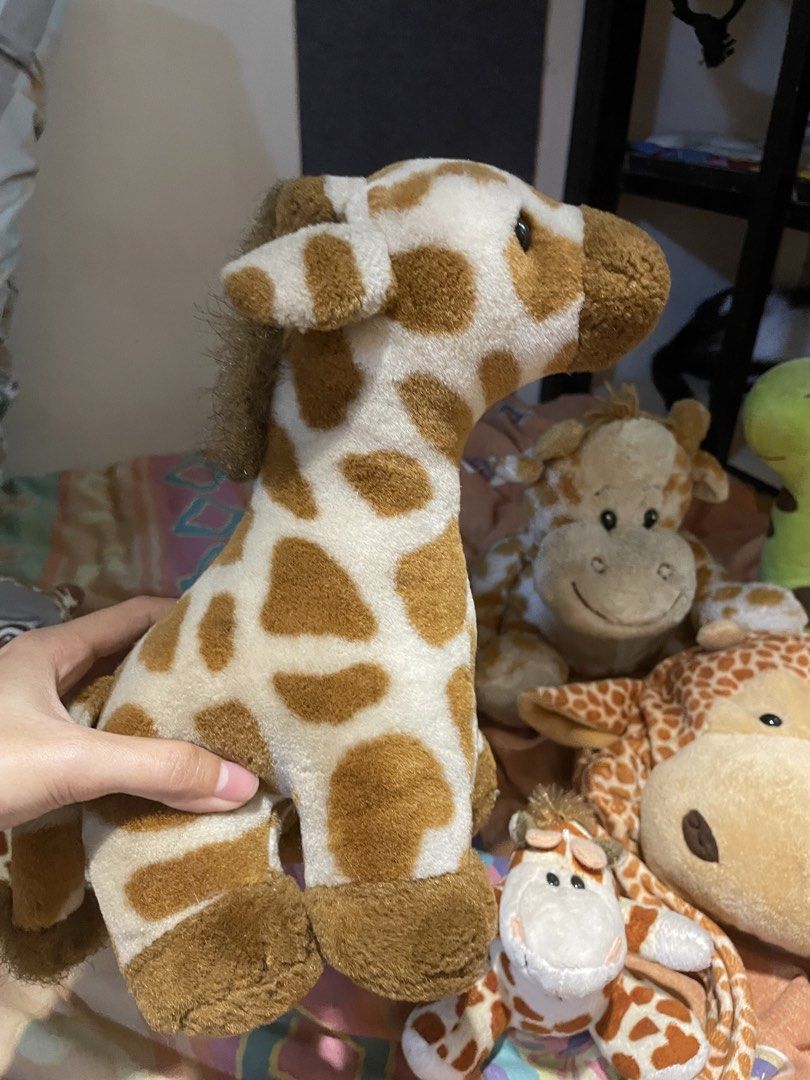Bundle of 6 Giraffe Plush Toys (Category: Plushies & Soft Toys) located in Rizal. Submitted by ces.z (Listing ID 1463775145, Image 2). Description: - Bundle of 6 adorable giraffe plush toys - Includes various sizes - Some feature cute ribbons and special details - Ideal for children's toys or a collector's display - Ready to bring joy to a new home!.
