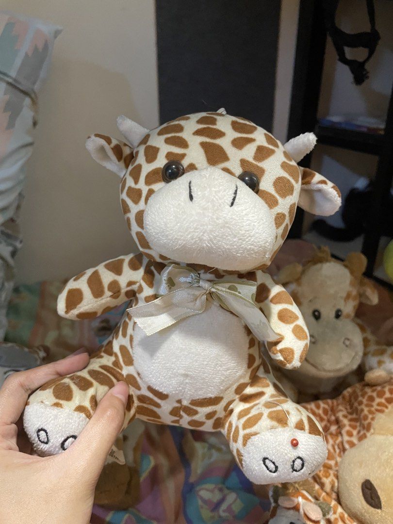 Bundle of 6 Giraffe Plush Toys (Category: Plushies & Soft Toys) located in Rizal. Submitted by ces.z (Listing ID 1463775145, Image 3). Description: - Bundle of 6 adorable giraffe plush toys - Includes various sizes - Some feature cute ribbons and special details - Ideal for children's toys or a collector's display - Ready to bring joy to a new home!.