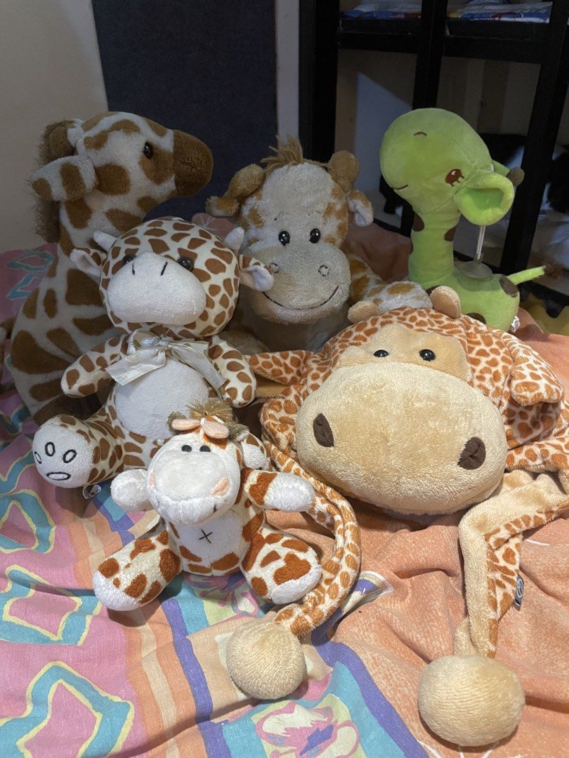 Bundle of 6 Giraffe Plush Toys (Category: Plushies & Soft Toys) located in Rizal. Submitted by ces.z (Listing ID 1463775145, Image 1). Description: - Bundle of 6 adorable giraffe plush toys - Includes various sizes - Some feature cute ribbons and special details - Ideal for children's toys or a collector's display - Ready to bring joy to a new home!.