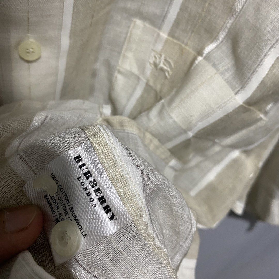 Burberry (Category: Luxury Apparel) located in Baguio. Submitted by loc_bc (Listing ID 1463899451, Image 3). Description: Burberry London button-up shirt featuring a neutral beige and off-white vertical striped pattern..