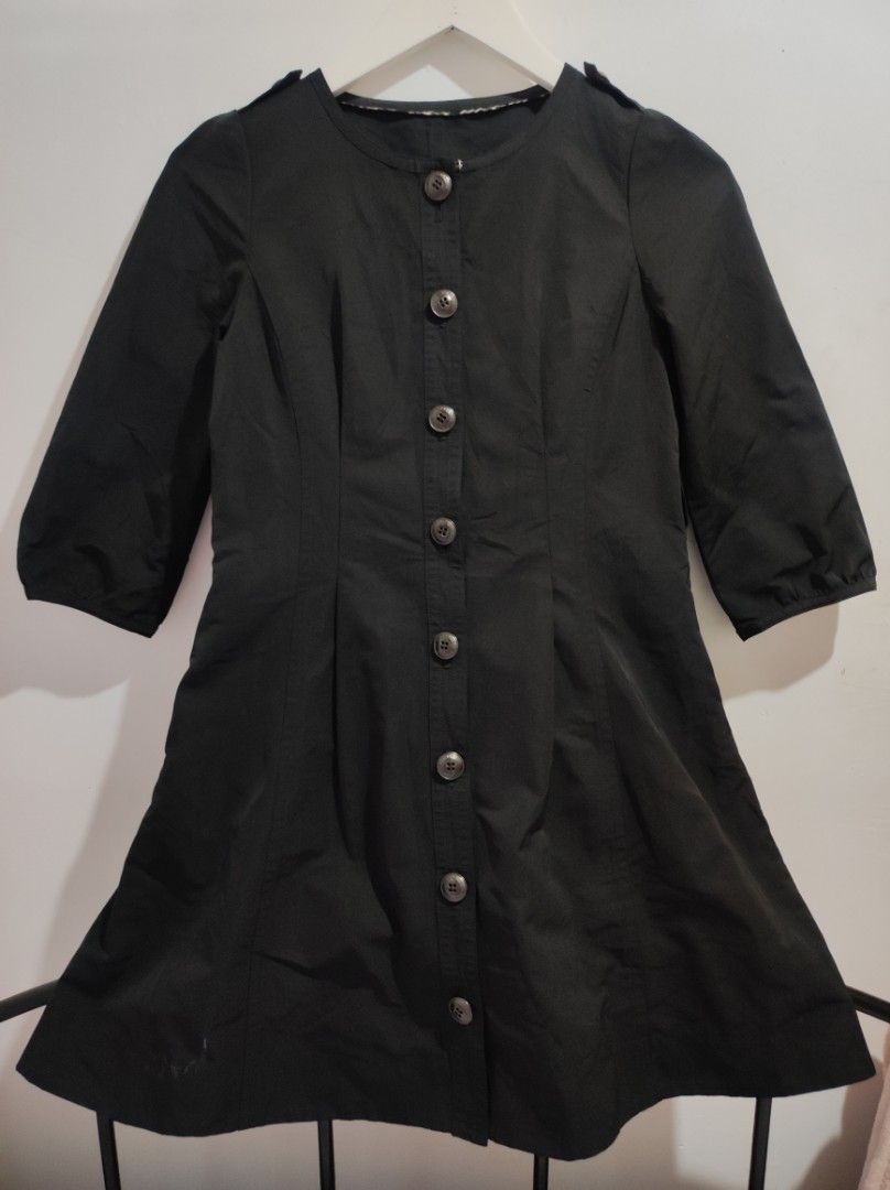 Authentic Burberry Blue Label Coat (Category: Coats, Jackets and Outerwear) located in Tagum. Submitted by sirenandsilk (Listing ID 1463790620, Image 1). Description: This is a Burberry Blue Label three-quarter sleeve cotton shirt dress in black..
