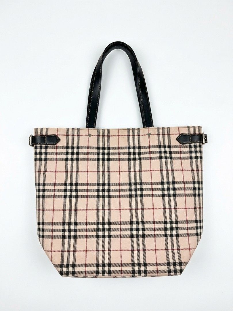 Burberry Haymarket Check Tote Bag (Category: Luxury Bags & Wallets) located in Leyte. Submitted by tibs1234 (Listing ID 1463760949, Image 1). Description: - Authentic Burberry Haymarket Check Tote Bag - Classic beige and red plaid pattern - Black leather handles and trim - Interior zip pocket for secure storage - Made in Japan - Authenticity tag clearly visible in photos.