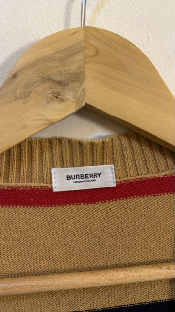 Burberry Striped Knit Cardigan (Category: Longsleeves) located in Paranaque City. Submitted by mykapoynton (Listing ID 1463882575, Image 3). Description: Burberry Striped Knit Cardigan - Iconic stripe pattern - V-neck design - Button-up front - Two front pockets - Material: Cashmere, Polyester, Nylon blend - Ideal for layering.