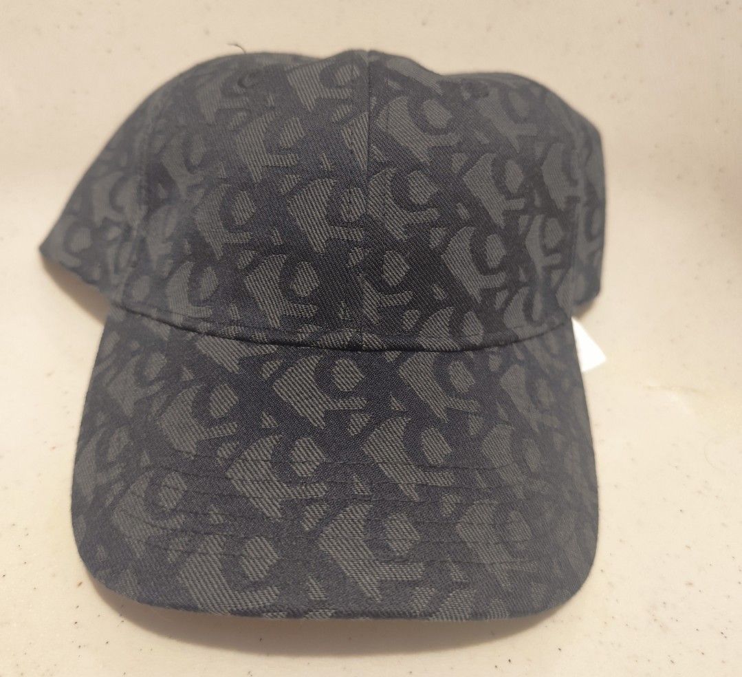 Calvin Klein Monogram Baseball Cap (Category: Caps & Hats) located in Imus. Submitted by jmakati22717201 (Listing ID 1463884605, Image 1). Description: - Classic black cap - All-over CK monogram pattern - Adjustable strap at the back for a perfect fit - Comes with original tags - Ideal for everyday wear.