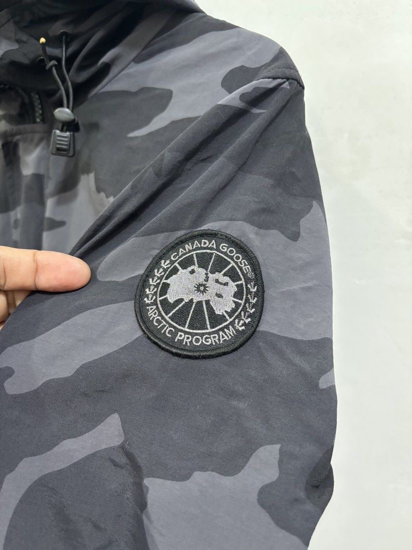 Canada Goose Charcoal Camouflage jacket (Category: Luxury Accessories) located in Taytay. Submitted by leanmark103093 (Listing ID 1463832674, Image 3). Description: C^N^D^ G00S€ Charcoal Camouflage Hooded Windbreaker Medium on tag W21 L26Front L28Back Excellent Condition Minimal issue sa buttons pero working padin check last photo 📩📩📩📩.