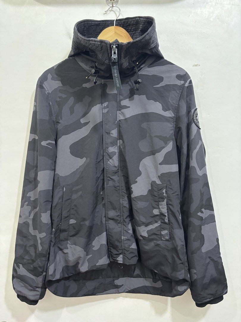 Canada Goose Charcoal Camouflage jacket (Category: Luxury Accessories) located in Taytay. Submitted by leanmark103093 (Listing ID 1463832674, Image 1). Description: C^N^D^ G00S€ Charcoal Camouflage Hooded Windbreaker Medium on tag W21 L26Front L28Back Excellent Condition Minimal issue sa buttons pero working padin check last photo 📩📩📩📩.