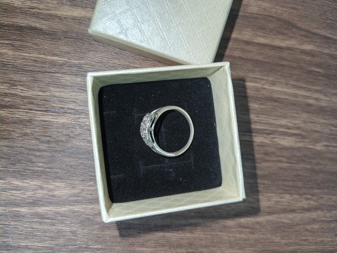 CC Logo Ring with Crystals (Category: Rings) located in Naga. Submitted by esteemed_shop (Listing ID 1463784728, Image 2). Description: - Elegant silver-tone ring - Features iconic CC logo design - Embellished with sparkling small crystals - Approximately size 7 (as per ring sizer) - Includes a beautiful gift box - Ideal for daily wear or special events.