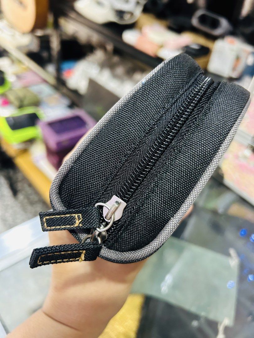 Cecil McBee Black Pouch with Gold Emblem (Category: Purses & Pouches) located in Manila. Submitted by starbalesukandjapansurplus (Listing ID 1463765955, Image 2). Description: - Black Cecil McBee pouch - Features iconic gold brand emblem on the front - Secure zipper closure with two pull tabs - Ideal for organizing small essentials like makeup or stationery - Compact and portable for on-the-go use.