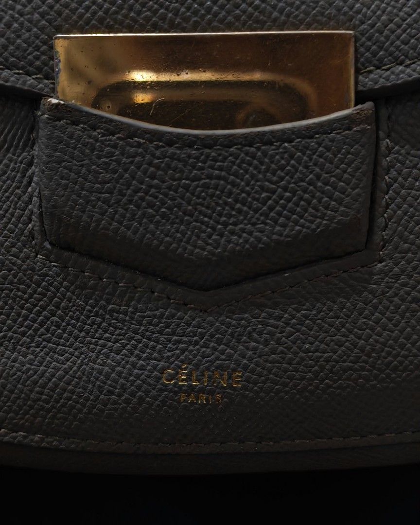 Celine Grey Leather Crossbody Bag (Category: Luxury Bags & Wallets) located in Baguio. Submitted by solo_ukay (Listing ID 1463808514, Image 3). Description: - Authentic Celine grey leather crossbody bag - Features a front zip pocket - Secure flap closure with a gold buckle - Adjustable strap for comfortable wear - Classic, minimalist design perfect for everyday use - Shows minor signs of wear on the hardware.