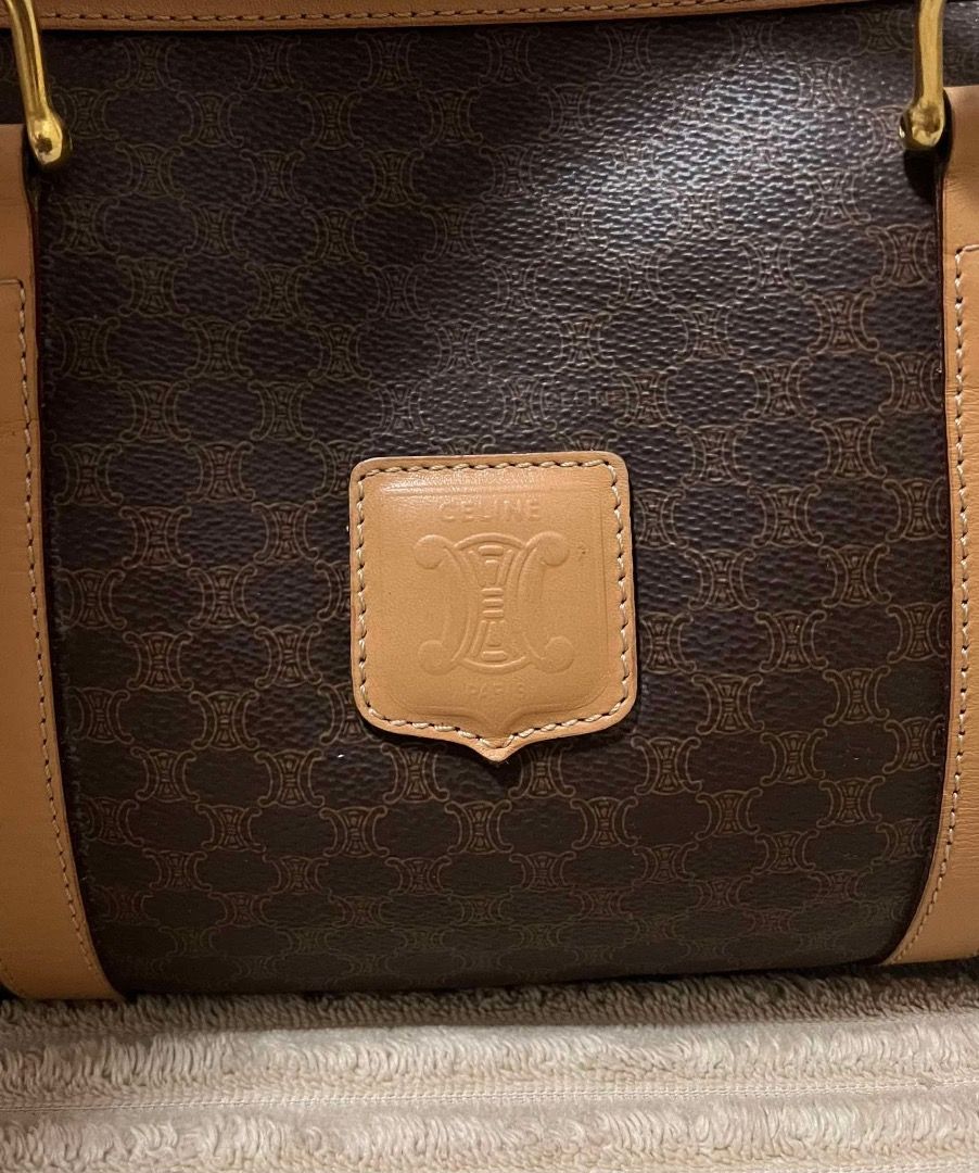 Celine macadam canvass boston bag (Category: Luxury Bags & Wallets) located in General Tinio. Submitted by happymoon.477c77 (Listing ID 1463744700, Image 3). Description: - Classic Celine Speedy Boston bag - Iconic Macadam print - Leather trim and handles - Gold hardware with Celine logo zipper pull - Interior zippered pocket - Great size for daily essentials - Timeless piece.