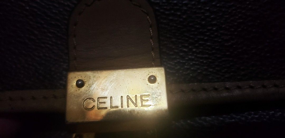 Celine Monogram Canvas Leather Trim Handbag (Category: Luxury Bags & Wallets) located in Marikina City. Submitted by racoon143 (Listing ID 1463855871, Image 3). Description: - Classic Celine monogram handbag - Color: Brown canvas with tan leather trim and handle - Hardware: Gold-tone - Closure: Combination lock - Style: Timeless piece for everyday use.