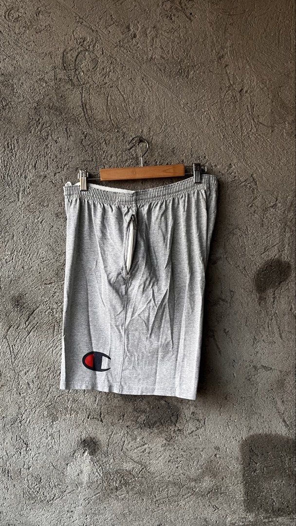 Champion Grey Athletic Shorts Size M (Category: Shorts) located in Cabuyao City. Submitted by bulandos (Listing ID 1463862461, Image 1). Description: - Grey Champion Shorts - Size: Medium - Elastic waistband with drawstring - Classic Champion logo on left leg - Comfortable cotton-polyester blend - Ideal for lounging and workouts.