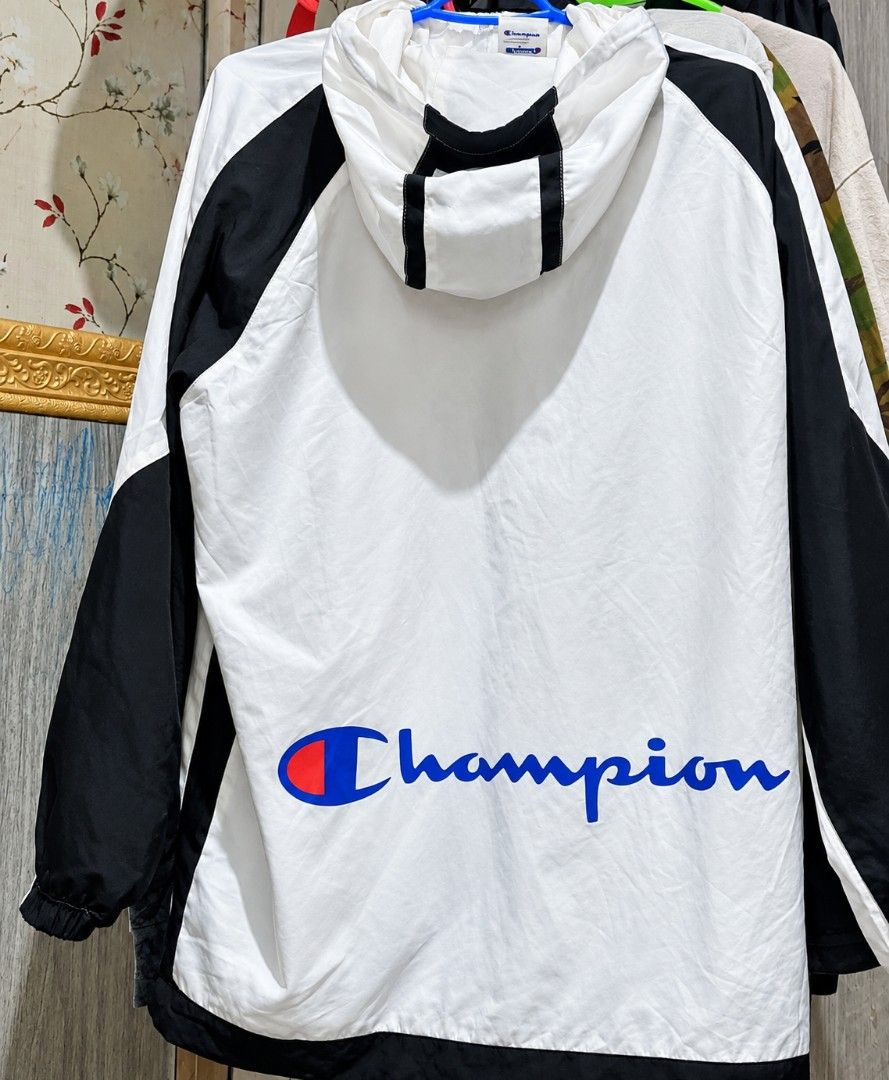 Champion White and Black Windbreaker Jacket (Category: Coats, Jackets and Outerwear) located in Manila. Submitted by christian_22 (Listing ID 1463822186, Image 1). Description: - Champion windbreaker jacket - White with black sleeves and accents - Large Champion logo on the back - Hooded design - Perfect for casual wear or light workouts - Easy to pack and wear on the go.