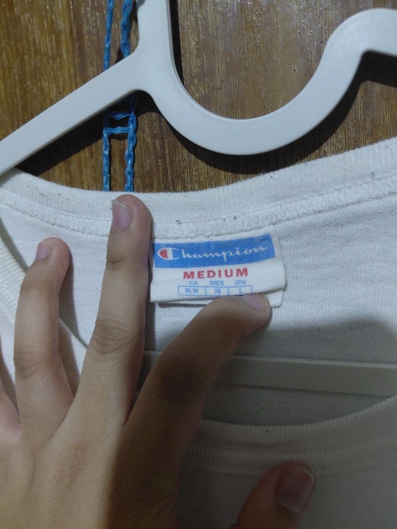 Champion White T-Shirt with Logo - Size Medium (Category: Shirts) located in Imus. Submitted by frootiloots4103 (Listing ID 1463753835, Image 3). Description: - Classic white Champion t-shirt - Features iconic Champion logo graphic on the front - Small embroidered Champion 'C' logo on the sleeve - Size: Medium - Ideal for casual, everyday wear OPEN FOR NEGO (best if aspack) 📍Imus, Cavite 4103 Can do meetups within Imus Area 🚚 J&T or Lalamove 📨