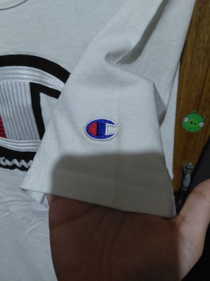 Champion White T-Shirt with Logo - Size Medium (Category: Shirts) located in Imus. Submitted by frootiloots4103 (Listing ID 1463753835, Image 2). Description: - Classic white Champion t-shirt - Features iconic Champion logo graphic on the front - Small embroidered Champion 'C' logo on the sleeve - Size: Medium - Ideal for casual, everyday wear OPEN FOR NEGO (best if aspack) 📍Imus, Cavite 4103 Can do meetups within Imus Area 🚚 J&T or Lalamove 📨