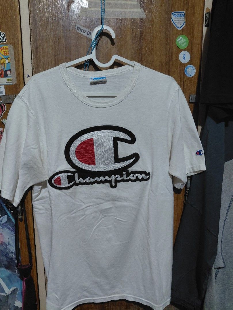 Champion White T-Shirt with Logo - Size Medium (Category: Shirts) located in Imus. Submitted by frootiloots4103 (Listing ID 1463753835, Image 1). Description: - Classic white Champion t-shirt - Features iconic Champion logo graphic on the front - Small embroidered Champion 'C' logo on the sleeve - Size: Medium - Ideal for casual, everyday wear OPEN FOR NEGO (best if aspack) 📍Imus, Cavite 4103 Can do meetups within Imus Area 🚚 J&T or Lalamove 📨