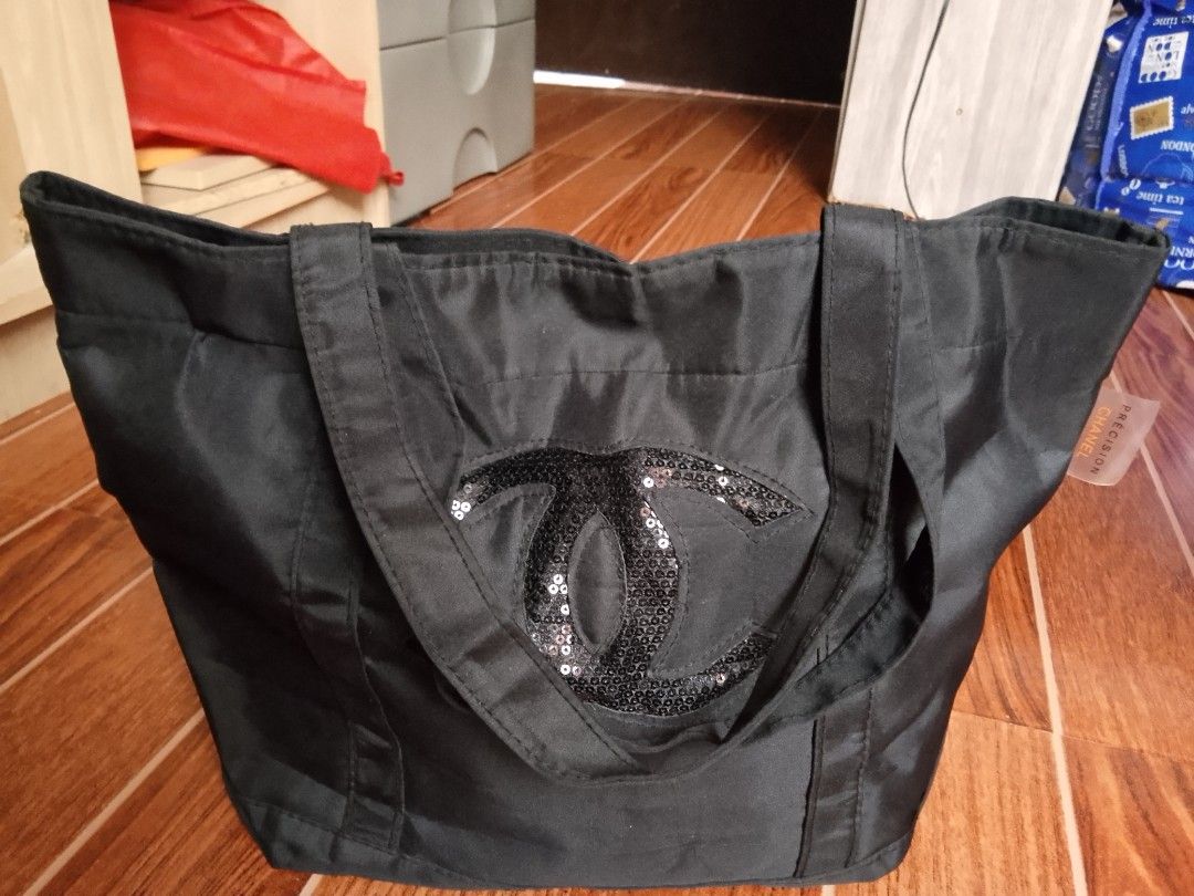 Chanel Black Sequins CC Logo Tote Bag (Category: Tote Bags) located in Manila. Submitted by wildwind_73f77a (Listing ID 1461590404, Image 1). Description: - Classic black Chanel tote bag - Features iconic CC logo with sequins - Durable material, perfect for daily use - Spacious interior for essentials - Comfortable straps for easy carrying - Stylish and practical design.