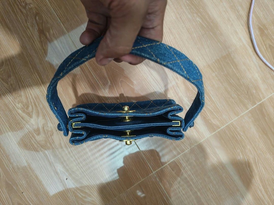 Chanel Denim Quilted Handbag (Category: Luxury Bags & Wallets) located in Baguio. Submitted by solo_ukay (Listing ID 1463803201, Image 3). Description: - Adorable denim Chanel handbag - Classic diamond quilting detail - Elegant gold hardware and clasp closure - Interior stamped with 'Chanel' and 'Made in France' - Convenient small top handle - Ideal for a chic, casual day out.