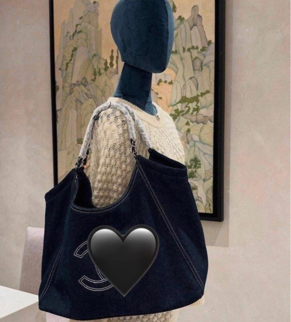 Chanel Denim Tote Bag (Category: Tote Bags) located in Manila. Submitted by nykji96 (Listing ID 1463861139, Image 2). Description: - Classic Chanel denim tote - Large capacity, ideal for everyday or travel - Iconic embroidered CC logo on the front - Comfortable chain and leather straps - Dark blue denim with white stitching - Versatile for any occasion.