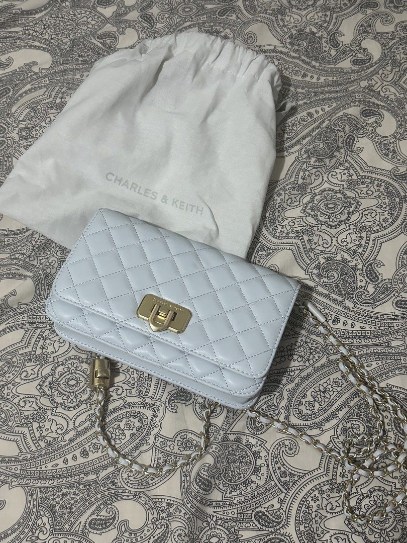 Charles and Keith Quilted Chain-Handle bag (Category: Cross-body Bags) located in Carmona. Submitted by helloimtelle (Listing ID 1463849385, Image 1). Description: decluttering! carmona / biñan location 📍 can do j&t, lbc or lalamove for 🚚 og price: 4k bought from store in bgc selling price: 1650 (nego) preloved like-new ch*arles and k*eith quilted chain-handle bag in seasalt blue color size: 18 × 11 × 7 cm color: seasalt blue material: vegan/sy