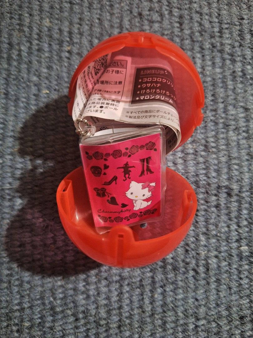 Charmmykitty Gachapon Capsule Toy Keychain (Category: Character Goods) located in Valenzuela. Submitted by rooooons (Listing ID 1463932259, Image 1). Description: - Authentic Charmmykitty gachapon keychain - Brand new, sealed in original capsule with paper insert - Adorable design featuring Charmmykitty, shoes, and roses - Ideal for Sanrio and Charmmykitty enthusiasts - Perfect as a small gift or for personal collection.