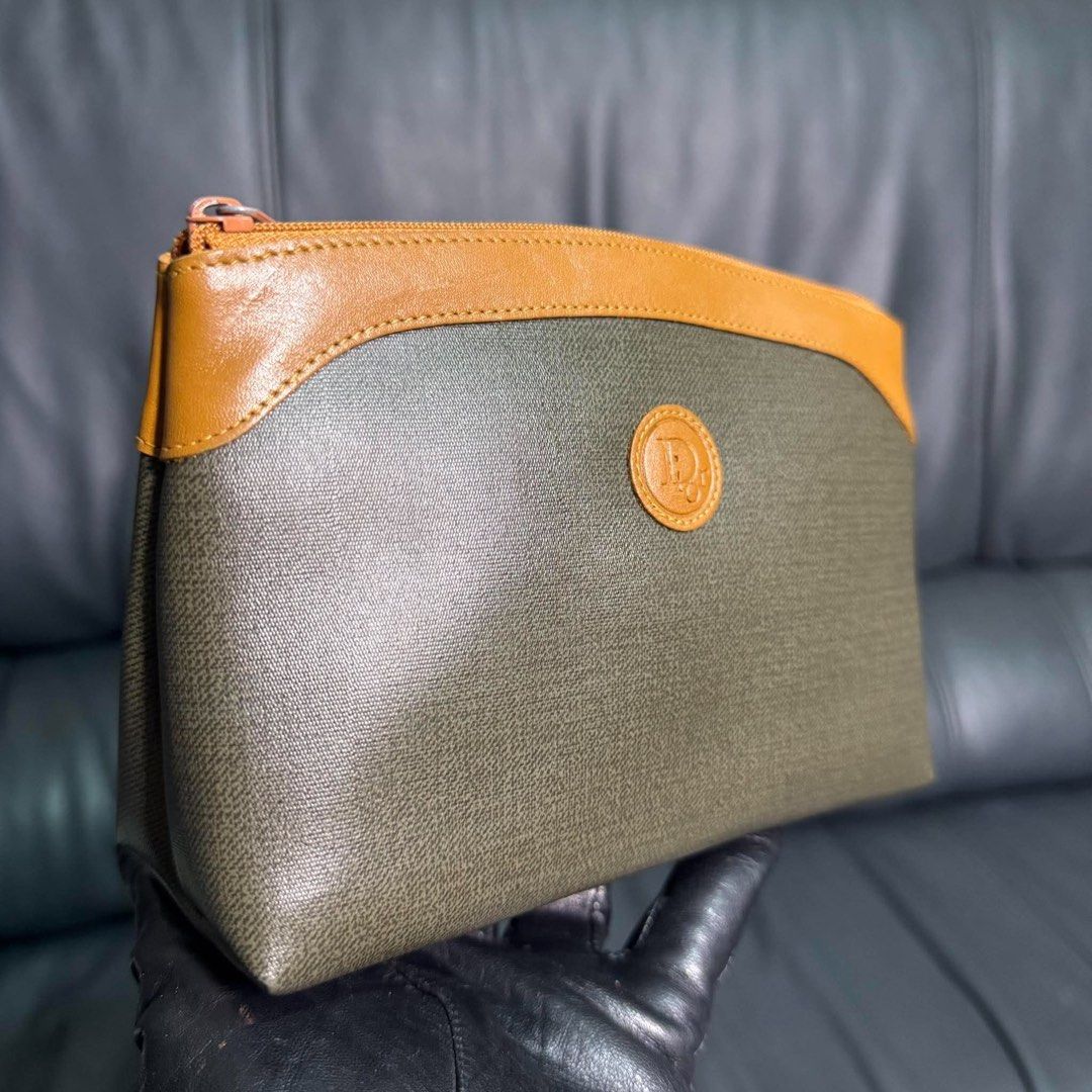 Christian Dior Pouch Cosmetic Bag (Category: Luxury Bags & Wallets) located in Madrid. Submitted by jhunaceee (Listing ID 1463748017, Image 3). Description: - Authentic Christian Dior pouch - Classic monogram pattern - Tan leather trim - Secure zipper closure - Ideal for makeup or daily essentials - Comes with original tag - A timeless Dior piece.