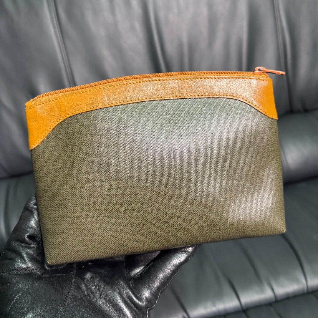 Christian Dior Pouch Cosmetic Bag (Category: Luxury Bags & Wallets) located in Madrid. Submitted by jhunaceee (Listing ID 1463748017, Image 2). Description: - Authentic Christian Dior pouch - Classic monogram pattern - Tan leather trim - Secure zipper closure - Ideal for makeup or daily essentials - Comes with original tag - A timeless Dior piece.