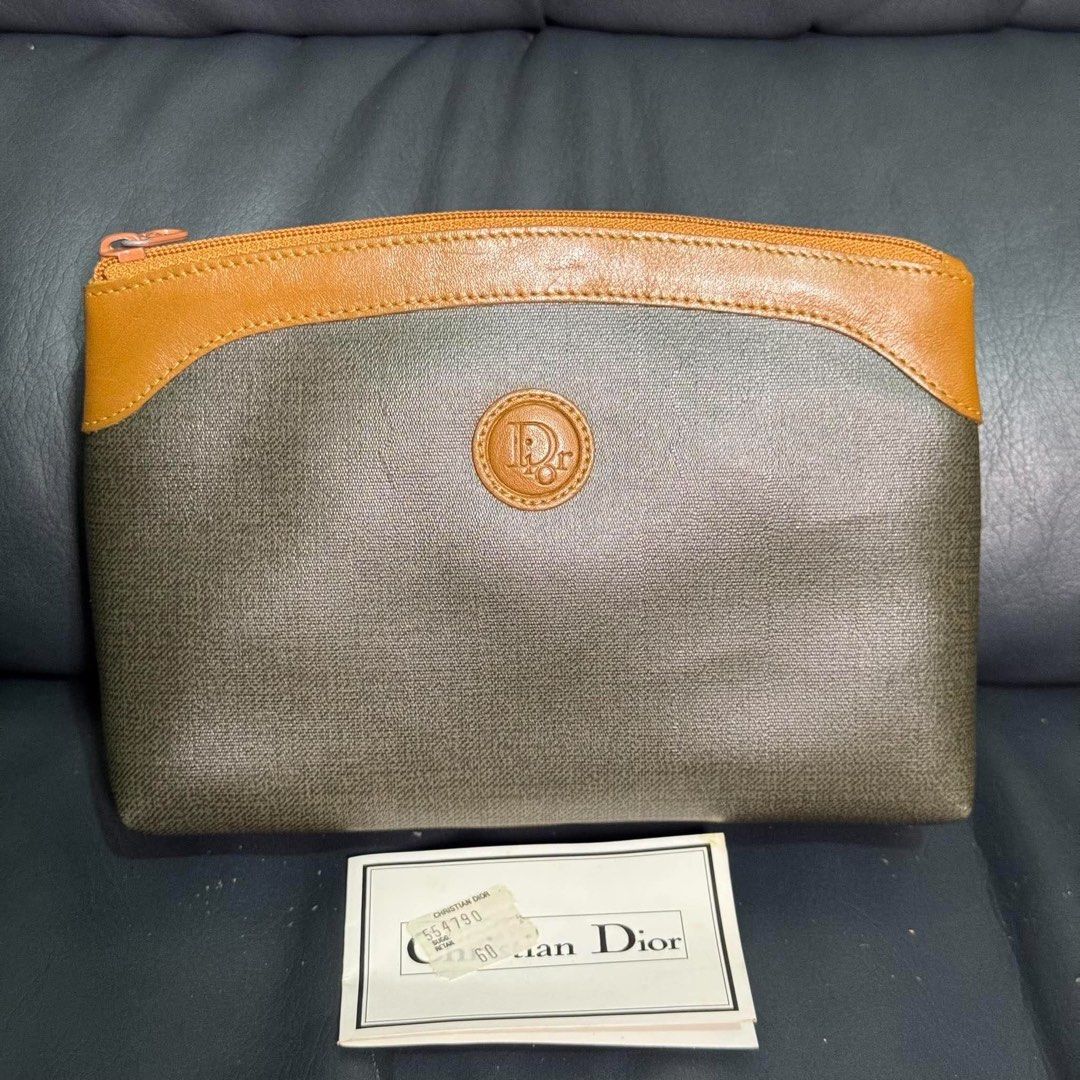 Christian Dior Pouch Cosmetic Bag (Category: Luxury Bags & Wallets) located in Madrid. Submitted by jhunaceee (Listing ID 1463748017, Image 1). Description: - Authentic Christian Dior pouch - Classic monogram pattern - Tan leather trim - Secure zipper closure - Ideal for makeup or daily essentials - Comes with original tag - A timeless Dior piece.