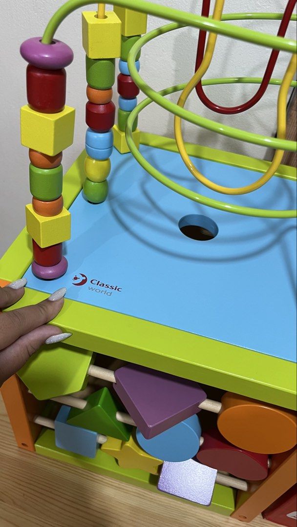 Classic World Multi-Activity Cube - Wooden Educational Toy (Category: Infant Playtime) located in Santa Rosa. Submitted by mommy.cole.affordable.stuff (Listing ID 1463802857, Image 2). Description: - Classic World Multi-Activity Cube - Made from natural, hand-crafted wood - Features: Bead maze, geometric shapes, clock - Promotes development of motor skills and cognitive abilities - Recommended for ages 2 and up.
