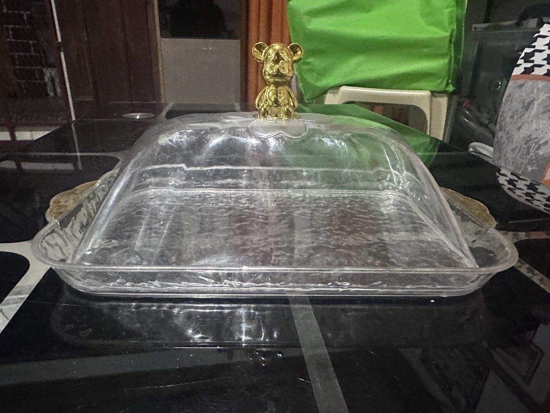 Clear Serving Tray with Bear Handle Dome Lid (Category: Food Organization & Storage) located in Manila. Submitted by zuripot0726 (Listing ID 1463870618, Image 1). Description: - Serving tray with a clear dome lid - Adorable gold bear handle on the lid - Convenient gold handles on the sides of the tray - Ideal for serving cakes, pastries, and other food items - Helps keep food fresh and protected - Great for parties and everyday use - dimensions o