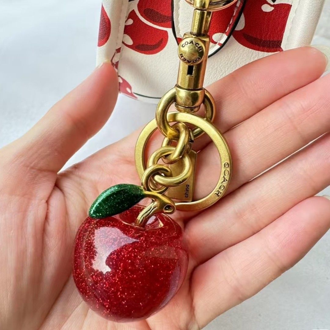 Coach Apple Bag Charm (Category: Charms) located in Pasig City. Submitted by maryjanegr (Listing ID 1463777018, Image 2). Description: 🍒 OG from Factory Outlet 🍒 Complete with Dustbag, Paperbag, and Care Card 🍒 Taguig Location.