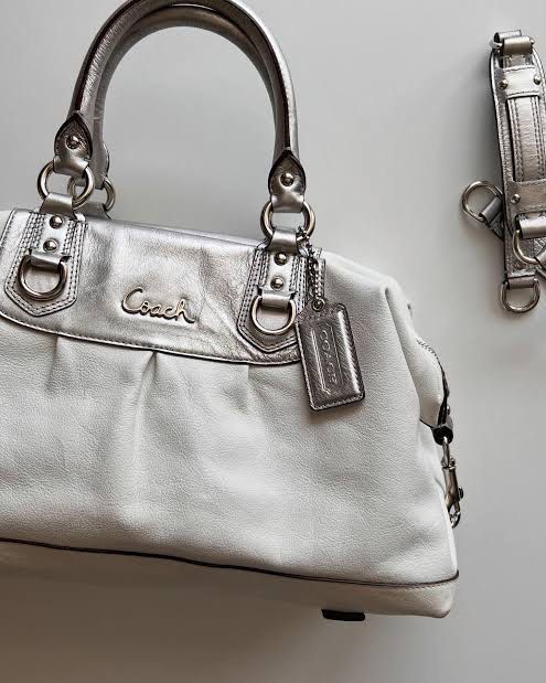Coach Ashley Silver Leather Satchel Handbag with Shoulder Strap (Category: Shoulder Bags) located in Makati City. Submitted by aurevelle.vintage (Listing ID 1463851663, Image 1). Description: [𝙍𝘼𝙍𝙀] ⋆.𐙚 ̊ Coach Ashley Silver Leather Two Way Handabg ⟡ with detachable strap ⟡ 𝙎𝙞𝙯𝙚: medium ⟡ 𝘿𝙞𝙢𝙚𝙣𝙨𝙞𝙤𝙣𝙨: ⟡ 𝙋𝙧𝙤𝙙𝙪𝙘𝙩 𝘾𝙤𝙣𝙙𝙞𝙩𝙞𝙤𝙣 𝙍𝙖𝙣𝙠: C ⟡ 𝙄𝙨𝙨𝙪𝙚/𝙨:faded leather |needs clean ⟡ 𝙊𝙥𝙚𝙣 𝙁𝙤𝙧 𝙇𝙖𝙮𝙖𝙬𝙖𝙮: 30% 