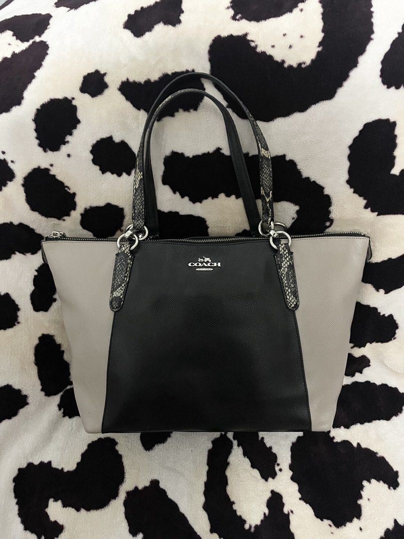 Coach Colorblock Leather Tote Bag (Category: Luxury Bags & Wallets) located in Cagayan de Oro. Submitted by luxieebags (Listing ID 1463928644, Image 1). Description: - Coach tote bag - Color: Black and light grey - Snake print detail on straps - Zipper closure - Spacious interior - Ideal for everyday use or work.