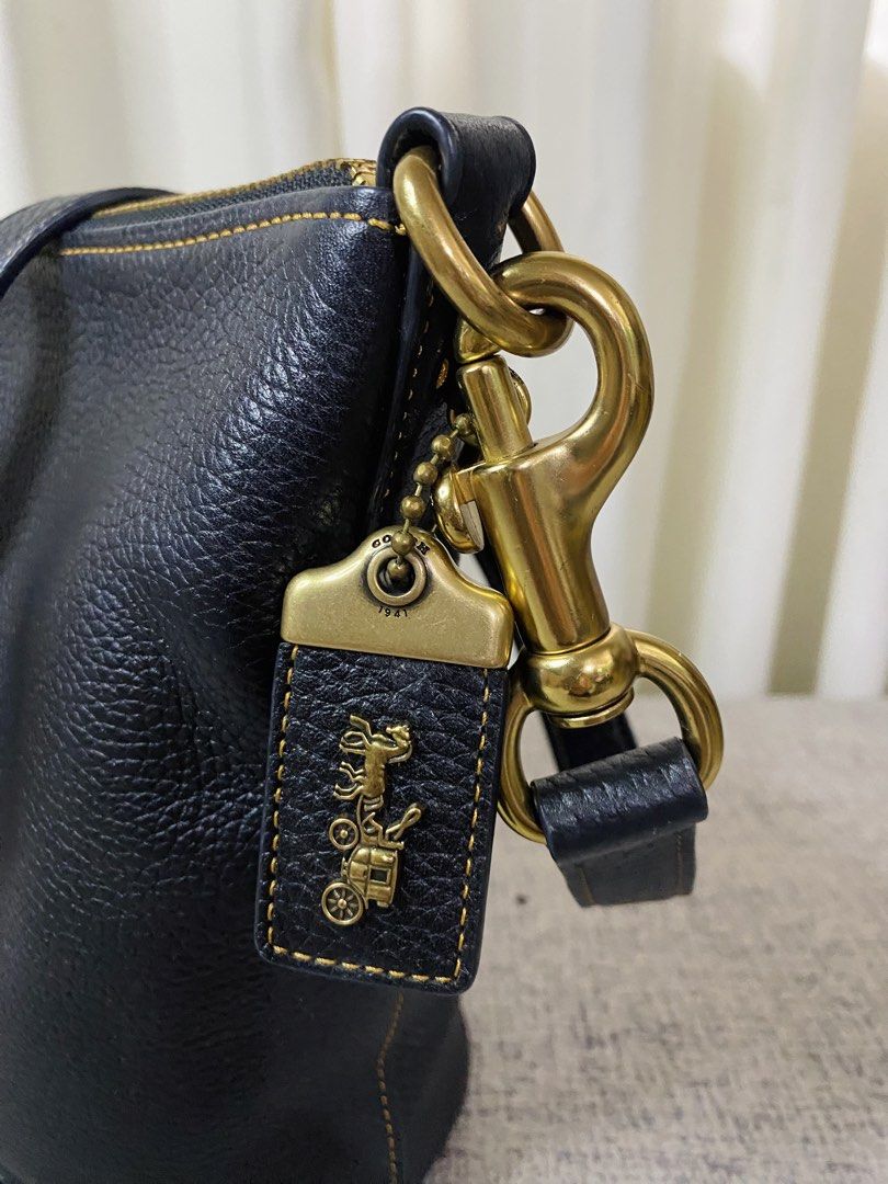 Coach Duffle 20 (Category: Luxury Bags & Wallets) located in Manila. Submitted by glen_n (Listing ID 1463759064, Image 3). Description: Coach Duffle 20 (Black/Brass) SRP: $490.00 Selling my personal Pre🖤 Coach Duffle 20 100% guaranteed original, bought from Duty Free (RETAIL, NOT an outlet stock). Condition: Excellent overall condition for both exterior and interior, except for the leather creed/story patch inside which shows flaking/wear (kindl