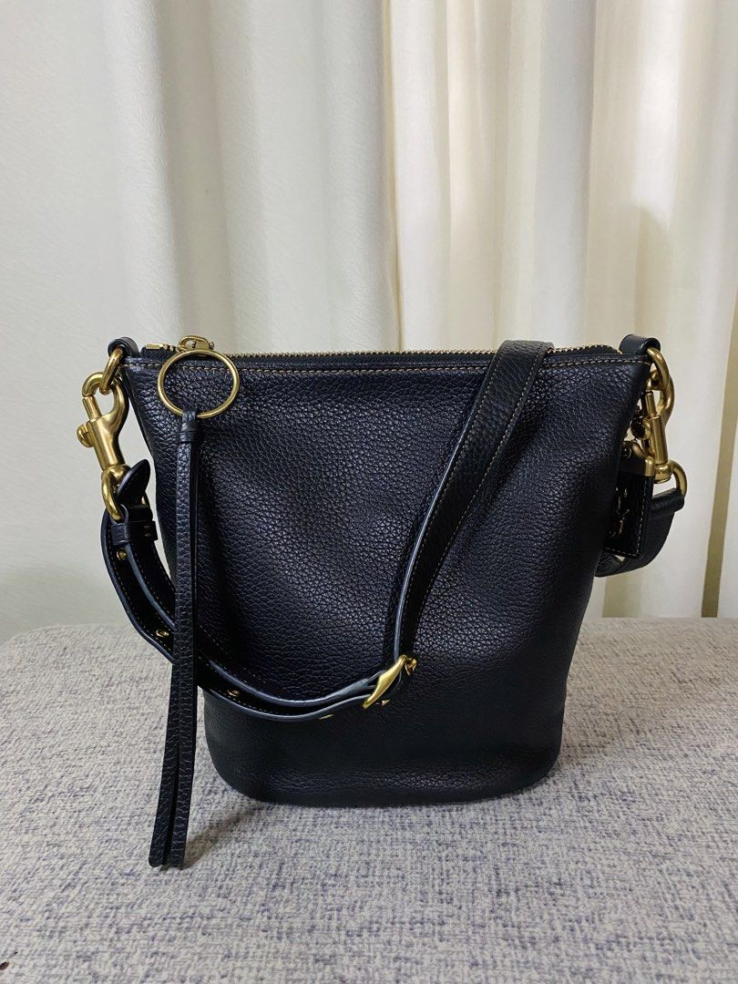 Coach Duffle 20 (Category: Luxury Bags & Wallets) located in Manila. Submitted by glen_n (Listing ID 1463759064, Image 2). Description: Coach Duffle 20 (Black/Brass) SRP: $490.00 Selling my personal Pre🖤 Coach Duffle 20 100% guaranteed original, bought from Duty Free (RETAIL, NOT an outlet stock). Condition: Excellent overall condition for both exterior and interior, except for the leather creed/story patch inside which shows flaking/wear (kindl