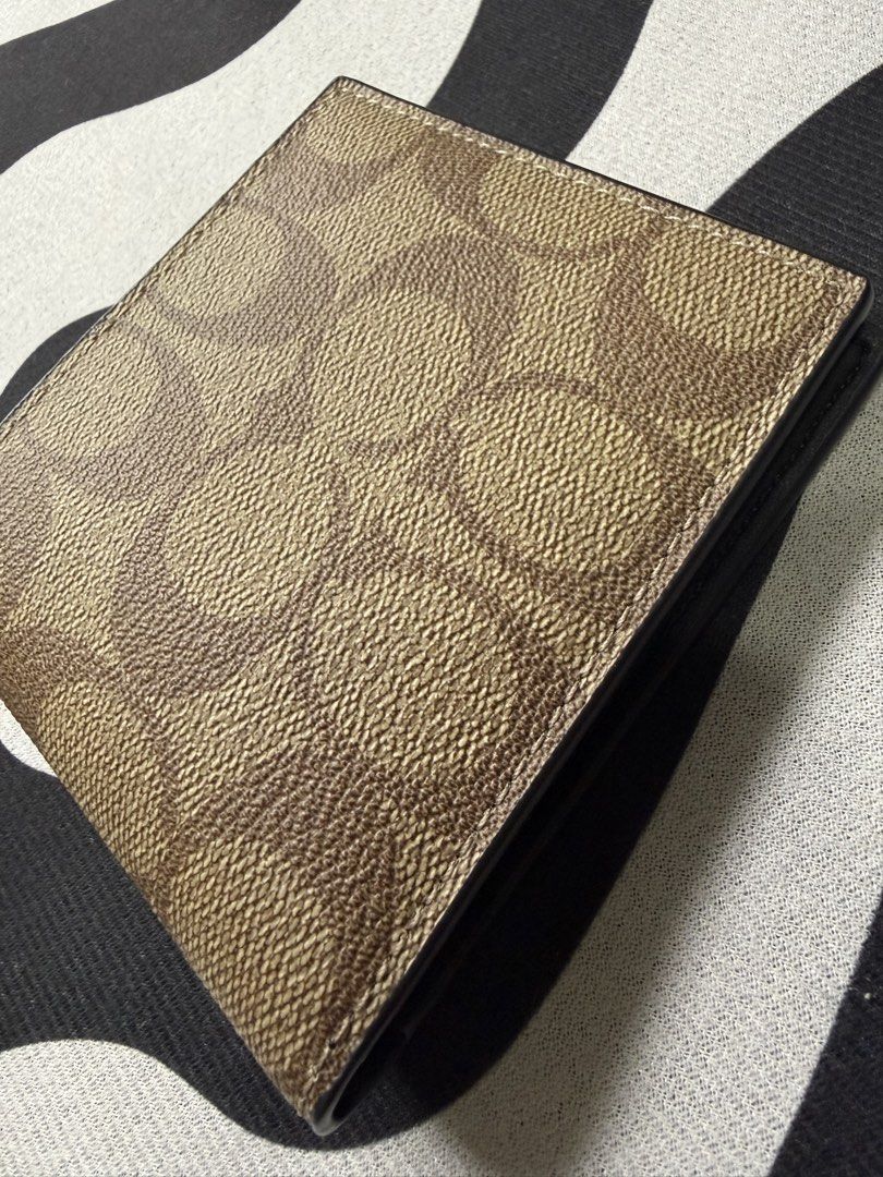 Coach ID Billfold Wallet (Category: Wallets & Card holders) located in Baguio. Submitted by mooi.kuryba (Listing ID 1463907267, Image 2). Description: Coach ID Billfold Wallet 👝 Signature Coated Canvass Brand New | Original L 4” x H 3.5” x W 0.5” 📏 7 card/ID slots/holder 🪪 1 full length bill compartment 💵 1 pc tan 🤎 @2,450 PHP Message us for orders! 📲 #coach #billfoldwallet #mooikuryba.