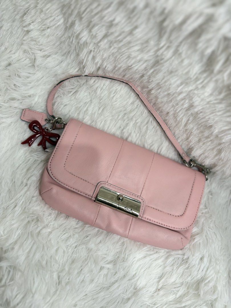 Coach Kristin wristlet mini bag (Category: Shoulder Bags) located in Cainta. Submitted by anneganda11 (Listing ID 1463926962, Image 1). Description: Coach kristin leather flap wristlet mini bag in baby pink.