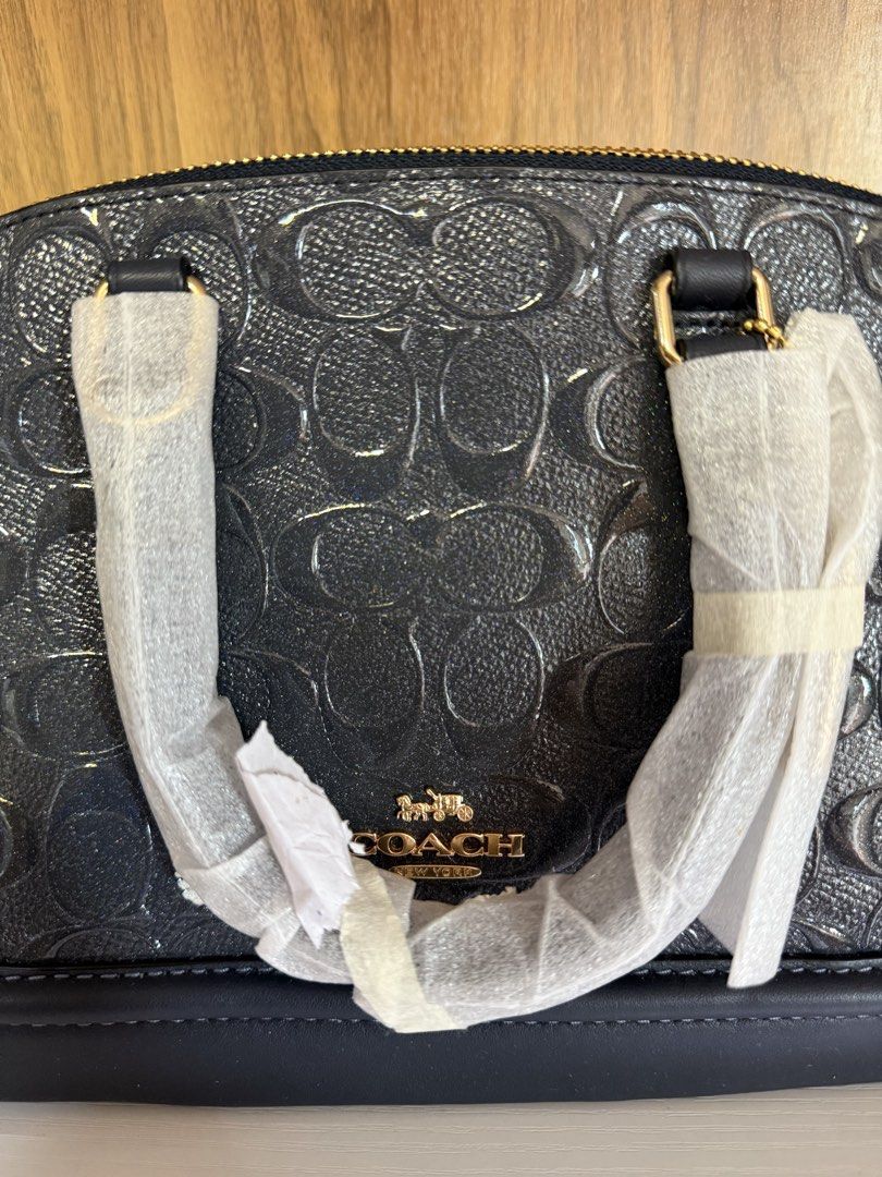 Coach Mini Sierra Satchel - Embossed Grey/Blue (Category: Luxury Bags & Wallets) located in Carmona. Submitted by prelovedbyallia (Listing ID 1452012924, Image 1). Description: Coach Mini Sierra Satchel - Embossed Midnight Grey/Blue • Authentic and bought from the US •Signature debossed patent leather •Inside multifunction pockets •Zip closure, fabric lining •Handles with 3 1/2″ drop •Dual top handles •Structured dome silhouette •Detachable strap