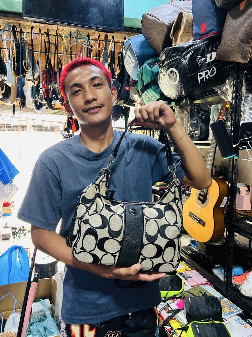 Coach Monogram Hobo Bag (Category: Luxury Bags & Wallets) located in Manila. Submitted by starbalesukandjapansurplus (Listing ID 1463769597, Image 3). Description: - Classic Coach hobo bag - Signature beige and black monogram pattern - Genuine leather trim and strap - Secure zipper closure - Spacious interior for essentials - Ideal for everyday use - Shows some signs of wear, but plenty of life left.
