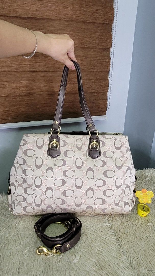 Coach Signature Cherry Charm Tote Bag (Category: Luxury Bags & Wallets) located in Cavite. Submitted by amairos (Listing ID 1463747717, Image 2). Description: - Coach canvas tote bag with signature 'C' pattern nice condition no major flaws minimal dirt inaide the bag .