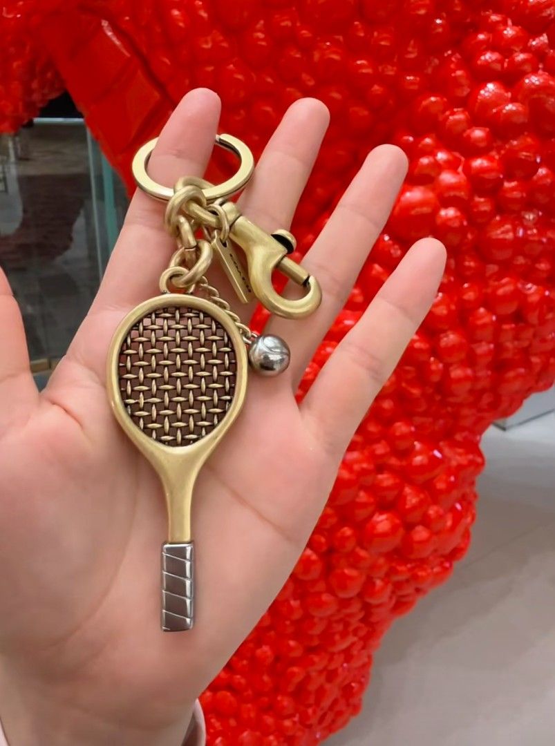 Coach Tennis Racket Bag Charm (Category: Charms) located in Pasig City. Submitted by maryjanegr (Listing ID 1463776902, Image 1). Description: 🍒 OG from Factory Outlet 🍒 Complete with Dustbag, Paperbag, and Care Card 🍒 Taguig Location.