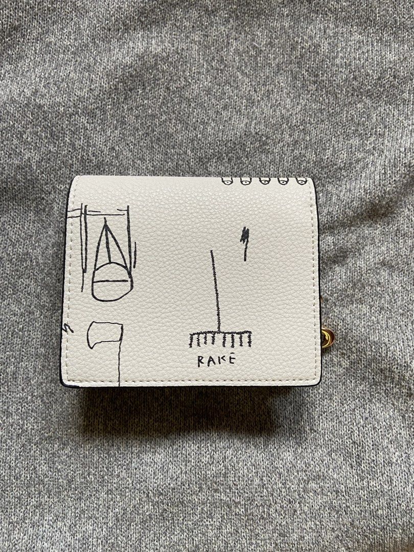 Coach x Basquiat Jean Michel Wallet (Category: Luxury Bags & Wallets) located in Makati City. Submitted by ellope (Listing ID 1460780327, Image 2). Description: Coach x Jean-Michel Basquiat bifold wallet in cream pebbled leather with iconic graphic print. Features card slots, ID window, and gold hardware. .