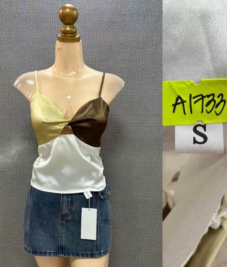 Colorblock Satin Camisole Top Size S (Category: Sleeveless) located in Mandaluyong City. Submitted by sheavein (Listing ID 1463907446, Image 1). Description: - Cute colorblock design - Silky satin material - Stylish front twist detail - Delicate spaghetti straps - Brand new with tag still attached - Versatile: pairs perfectly with jeans or skirts.