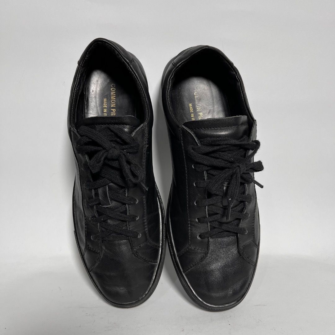 Common Projects Black Leather Sneakers (Category: Sneakers) located in Davao. Submitted by twistedswagger (Listing ID 1463864900, Image 2). Description: - Classic black leather sneakers - Brand: Common Projects - Signature gold serial number stamped on heel - Lace-up front - Made in Italy - Versatile for casual and smart-casual wear.