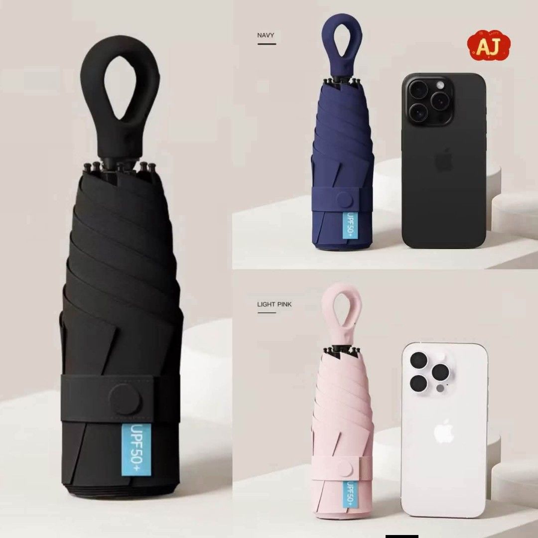 Compact Travel Umbrella - UPF 50+ Sun Protection (Category: Umbrellas) located in Manila. Submitted by iliasjen3082126 (Listing ID 1463929949, Image 3). Description: - Super compact, fits easily in your bag - Perfect for sunny days or unexpected rain - Offers UPF 50+ sun protection - Available in navy, black, and light pink - Features a convenient loop for hanging.
