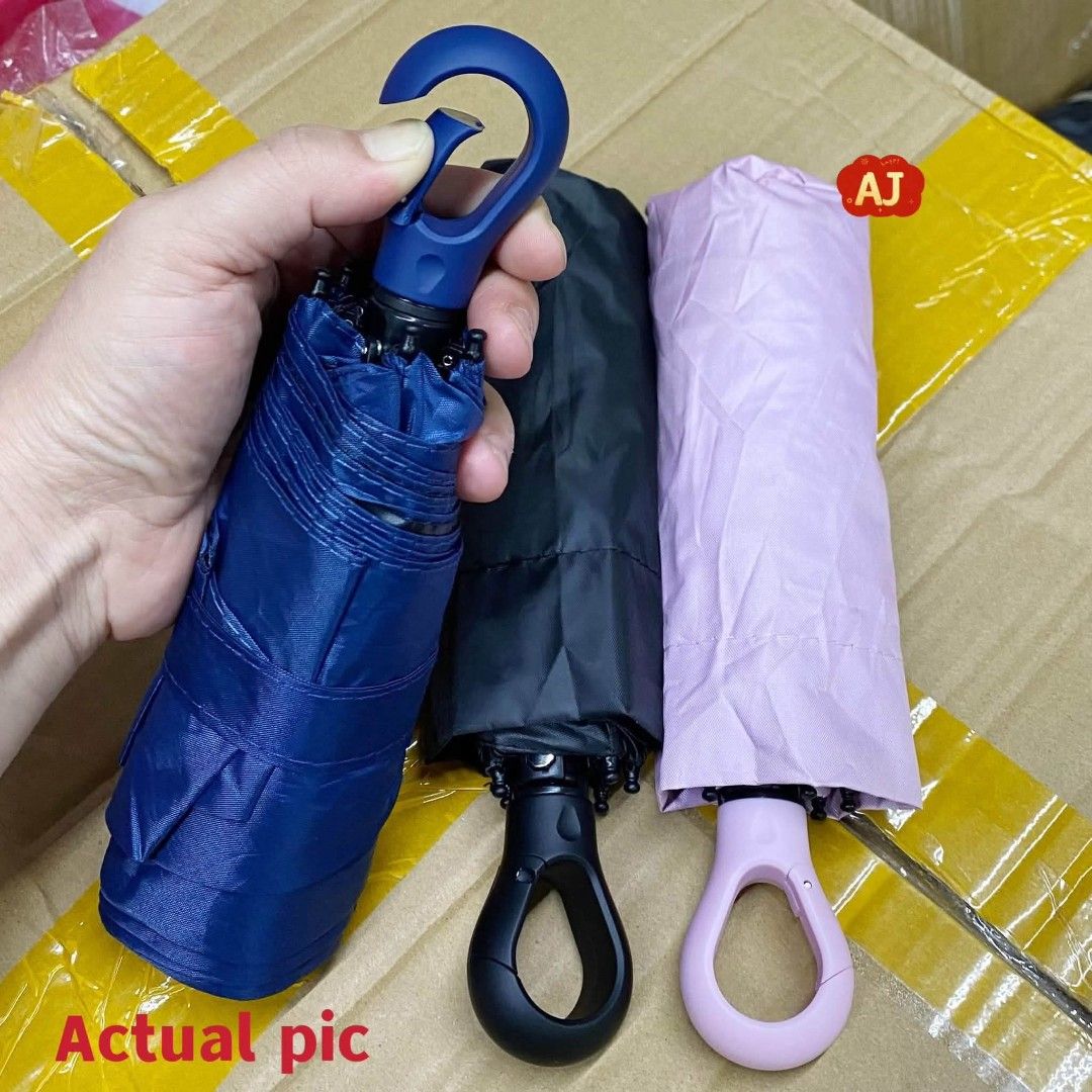 Compact Travel Umbrella - UPF 50+ Sun Protection (Category: Umbrellas) located in Manila. Submitted by iliasjen3082126 (Listing ID 1463929949, Image 1). Description: - Super compact, fits easily in your bag - Perfect for sunny days or unexpected rain - Offers UPF 50+ sun protection - Available in navy, black, and light pink - Features a convenient loop for hanging.