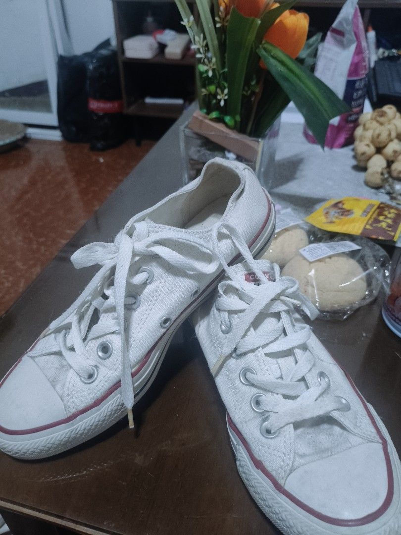 Converse All Star White Canvas Low Top Sneakers (Category: Sneakers) located in Apalit. Submitted by oemiluanne (Listing ID 1463898213, Image 2). Description: - Classic white Converse low tops - Canvas material with red trim - Laces included - Soles show some wear but have plenty of grip - Ideal for everyday wear - Size: 7 US Women's size 7.5 💯 orig bought at sm pampanga RS: de- clutter need ng linis.