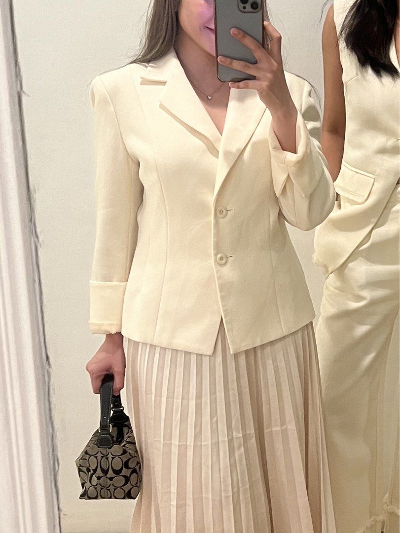High Quality Cream Blazer (Category: Coats, Jackets and Outerwear) located in Makati City. Submitted by warm.abc123 (Listing ID 1463861812, Image 2). Description: - Cream colored blazer - Single button closure - Lapel collar - Long sleeves - Versatile for layering or wearing on its own - Pairs well with skirts or trousers.