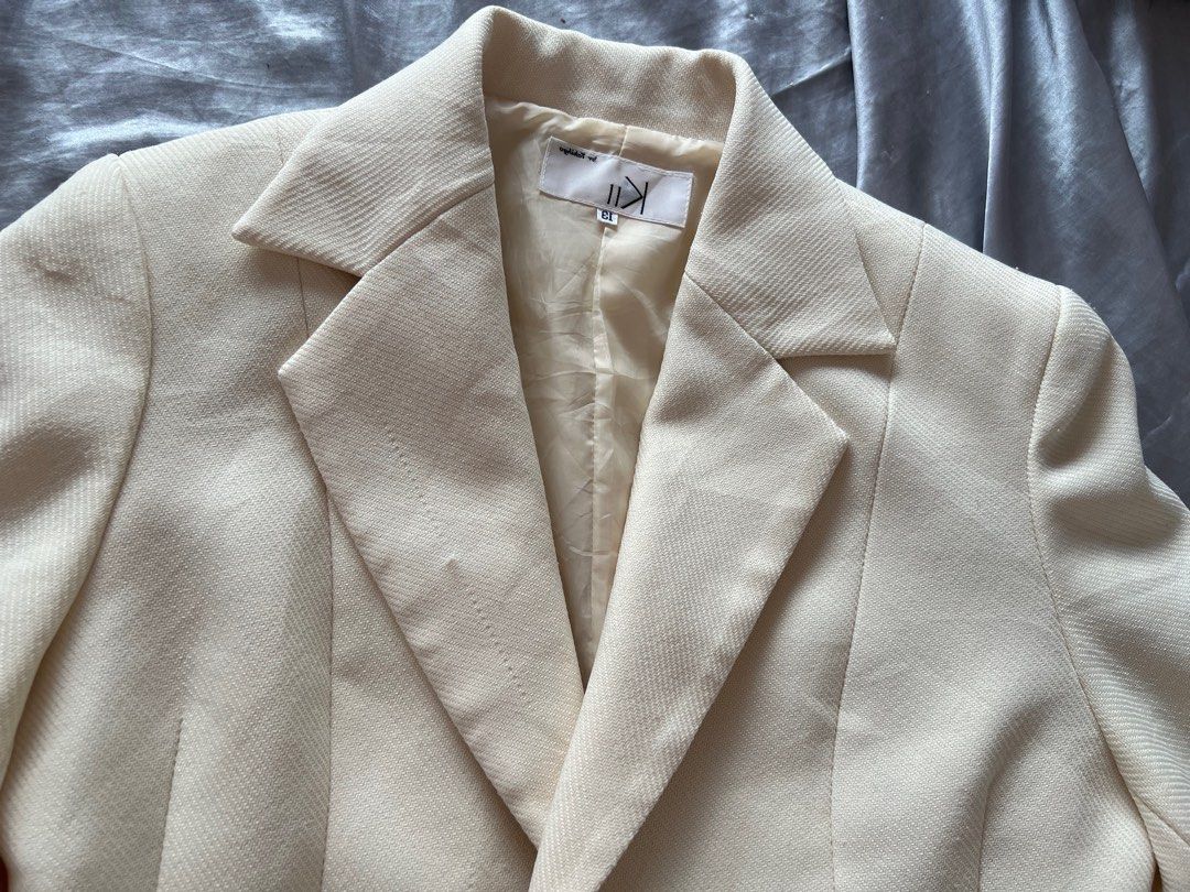 High Quality Cream Blazer (Category: Coats, Jackets and Outerwear) located in Makati City. Submitted by warm.abc123 (Listing ID 1463861812, Image 3). Description: - Cream colored blazer - Single button closure - Lapel collar - Long sleeves - Versatile for layering or wearing on its own - Pairs well with skirts or trousers.