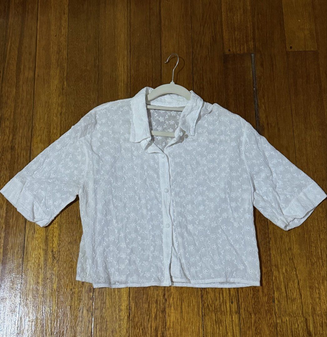 Cropped Blouse (Category: Blouses) located in Paranaque City. Submitted by declutternsell.729 (Listing ID 1463774471, Image 2). Description: - Cute white cropped shirt - Features all-over broderie anglaise floral pattern - Collared neckline with button-up front - Short sleeves - Versatile for casual outings or as a beach cover-up BOUGHT IN THAILANS USED ONCE.